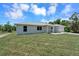 House exterior with grassy lawn and driveway at 221 Evergreen St, Punta Gorda, FL 33982
