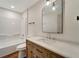 Bathroom with a bathtub, toilet and modern vanity at 221 Evergreen St, Punta Gorda, FL 33982