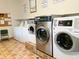 Clean laundry room with multiple washers and dryers at 2125 Canal Dr # B23, Bradenton, FL 34207