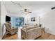 Living room features wood flooring, comfy seating, and access to a patio at 3245 Beneva Rd # 104, Sarasota, FL 34232
