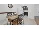 Cozy dining area with granite table and four chairs at 3245 Beneva Rd # 104, Sarasota, FL 34232