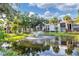 Serene pond with a water fountain feature at 3245 Beneva Rd # 104, Sarasota, FL 34232
