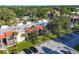 Aerial view of condo building showcasing its architecture and parking at 3245 Beneva Rd # 104, Sarasota, FL 34232