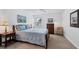 Spacious bedroom with a wooden bed frame and ample storage at 3245 Beneva Rd # 104, Sarasota, FL 34232