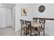 Charming dining area with granite table and four chairs at 3245 Beneva Rd # 104, Sarasota, FL 34232