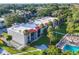 Complex view shows building, pool, and surrounding landscape at 3245 Beneva Rd # 104, Sarasota, FL 34232