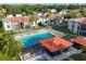 Community pool and recreation area with surrounding buildings and landscaping at 3245 Beneva Rd # 104, Sarasota, FL 34232
