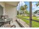 Relaxing screened patio with outdoor seating, overlooking the community at 3245 Beneva Rd # 104, Sarasota, FL 34232
