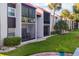 Building exteriors showcase screened lanais and lush landscaping at 3245 Beneva Rd # 104, Sarasota, FL 34232