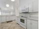 White kitchen with ample counter space and cabinets at 4113 Putter Pl, Bradenton, FL 34203