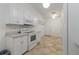 White appliances and cabinets in kitchen at 4113 Putter Pl, Bradenton, FL 34203