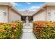 Entryway with wrought iron gate and lush landscaping at 4113 Putter Pl, Bradenton, FL 34203