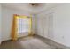 Bright bedroom with window, carpet, and built-in closet at 4113 Putter Pl, Bradenton, FL 34203