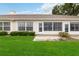 Small patio with sliding glass door and potted plant at 4113 Putter Pl, Bradenton, FL 34203