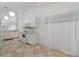 View of kitchen with white cabinets and tile floor at 4113 Putter Pl, Bradenton, FL 34203