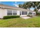 Rear view of a house showing patio and lawn at 4113 Putter Pl, Bradenton, FL 34203