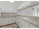 White kitchen with ample cabinetry and counter space at 4113 Putter Pl, Bradenton, FL 34203