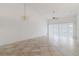 Living room with tile floors, ceiling fan, and chandelier at 4113 Putter Pl, Bradenton, FL 34203