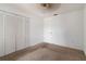 Well-lit bedroom featuring a closet and door at 4113 Putter Pl, Bradenton, FL 34203