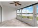 Sunroom with tiled floor and view of a lake at 4113 Putter Pl, Bradenton, FL 34203