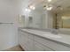 Bathroom with double vanity and a large mirror at 4113 Putter Pl, Bradenton, FL 34203