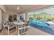 Spacious pool and spa area with screened patio and dining area at 139 Long Meadow Lane Ln, Rotonda West, FL 33947