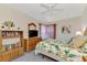 Cozy bedroom with a double bed, dresser, and built in shelving at 139 Long Meadow Lane Ln, Rotonda West, FL 33947