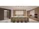 Modern kitchen with island and stainless steel appliances at 555 Quay Cmn # 803, Sarasota, FL 34236