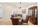 Dining area with kitchen pass-through and display cabinet at 341 Cape Harbour Loop # 105, Bradenton, FL 34212