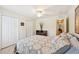 Bedroom with double bed, ceiling fan, and window with shutters at 341 Cape Harbour Loop # 105, Bradenton, FL 34212