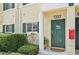 Green front door with columns and landscaping at 341 Cape Harbour Loop # 105, Bradenton, FL 34212