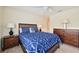 Bedroom with double bed, wooden dresser, and nautical decor at 341 Cape Harbour Loop # 105, Bradenton, FL 34212