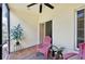 Relaxing screened porch with pink chairs and tiled floor at 341 Cape Harbour Loop # 105, Bradenton, FL 34212