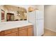 Kitchen with white appliances and light wood cabinets at 341 Cape Harbour Loop # 105, Bradenton, FL 34212