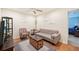 Cozy sitting area with sofa, chair, and TV at 341 Cape Harbour Loop # 105, Bradenton, FL 34212