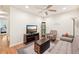 Small sitting area with sofa, chair, and TV at 341 Cape Harbour Loop # 105, Bradenton, FL 34212