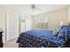 Bedroom with double bed, white closet doors, and nautical bedding at 341 Cape Harbour Loop # 105, Bradenton, FL 34212