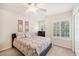 Bedroom with double bed, ceiling fan, and window with shutters at 341 Cape Harbour Loop # 105, Bradenton, FL 34212