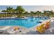 Resort-style pool with lounge chairs and landscaping at 10112 Cross River Trl, Parrish, FL 34219