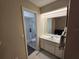 Clean bathroom with a vanity, toilet and shower at 4373 Watova Ave, North Port, FL 34286