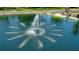 Peaceful water fountain in a community lake at 11 Sandy Cove Rd # 8-F, Sarasota, FL 34242