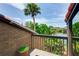 Private balcony overlooking the lake and tropical foliage at 11 Sandy Cove Rd # 8-F, Sarasota, FL 34242