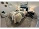 Cozy bedroom with stylish decor, a comfortable bed, and a relaxing atmosphere at 17445 Opal Sand Dr # 104, Venice, FL 34293