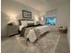 Bright bedroom featuring neutral tones, plush rug, and coordinated decor for a cozy and inviting space at 17445 Opal Sand Dr # 104, Venice, FL 34293
