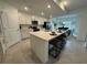Spacious kitchen with a large island, modern appliances, and open layout for entertaining at 17445 Opal Sand Dr # 104, Venice, FL 34293