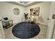 Contemporary office space featuring a glass desk, modern art, and a stylish rug at 17445 Opal Sand Dr # 104, Venice, FL 34293