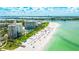 Aerial view showcasing resort, beach, and ocean at 455 Longboat Club Rd # 807, Longboat Key, FL 34228