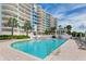 Resort-style pool with surrounding lounge chairs at 455 Longboat Club Rd # 807, Longboat Key, FL 34228