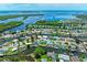 Aerial view showcases waterfront homes with backyard pools and private docks on picturesque canals at 5111 Coral Blvd, Bradenton, FL 34210
