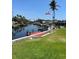 Canal-front property boasts a long dock and lush green backyard at 5111 Coral Blvd, Bradenton, FL 34210